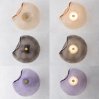 Organic glass wall light in amber, grey and purple finishes (on and off)