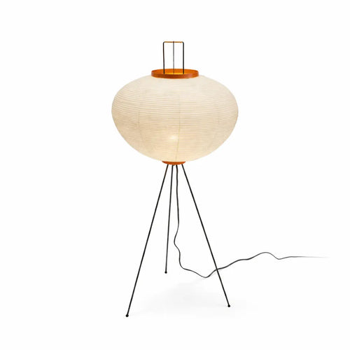 Japanese paper floor lamp with tripod metal stand and warm ambient light