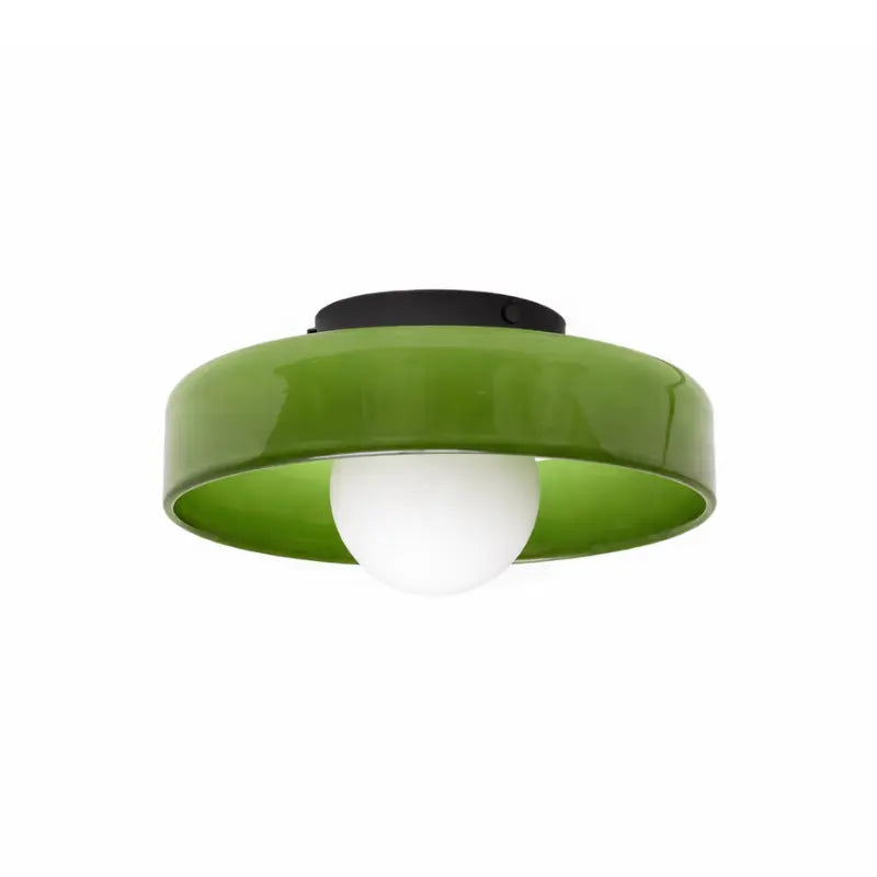 Green flush mount ceiling light with opal glass globe and black base