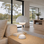 White mushroom table lamp on wooden side table in modern living room