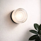 Frosted glass round wall sconce with soft LED glow
