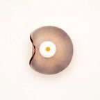 Close-up taupe organic glass LED wall light