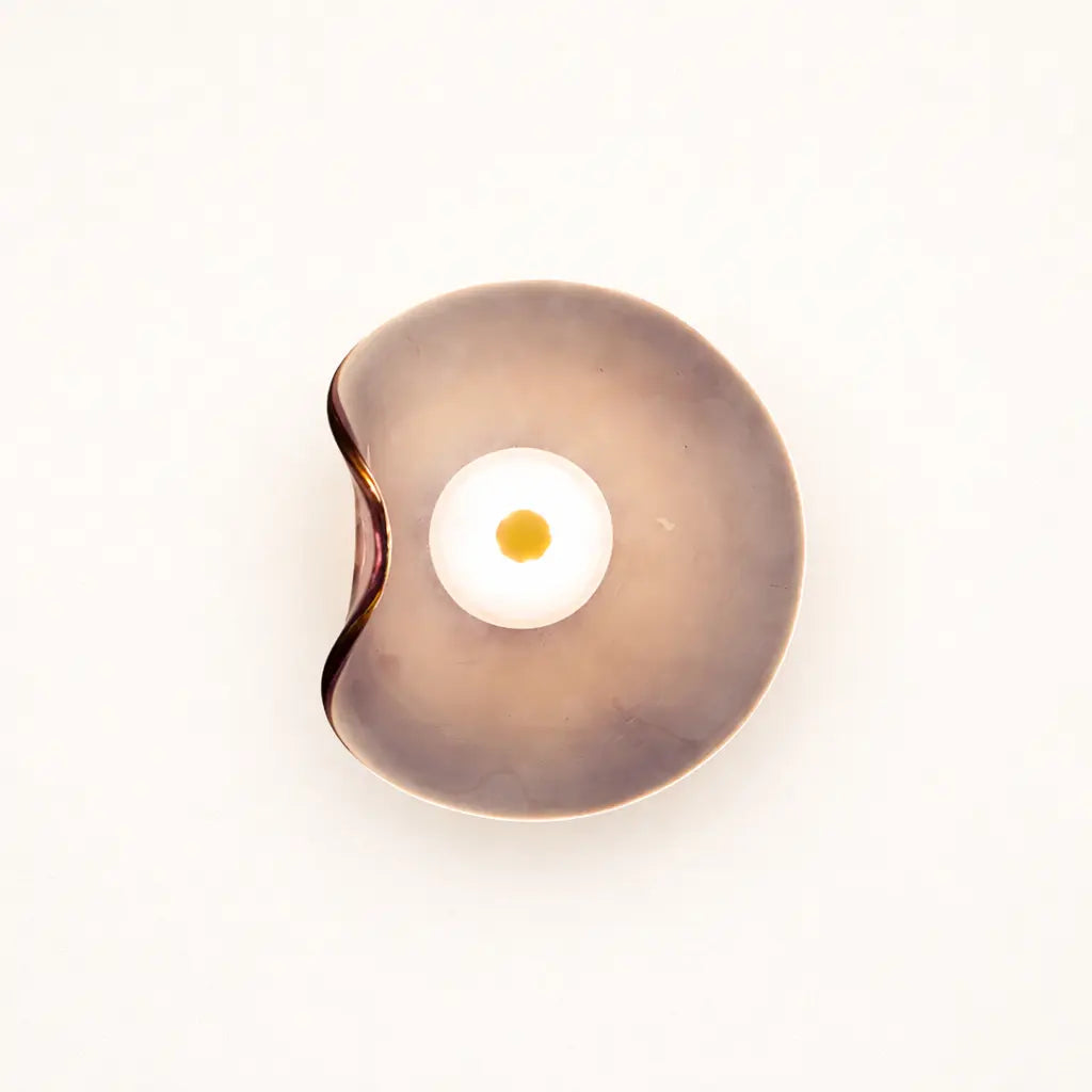 Close-up taupe organic glass LED wall light