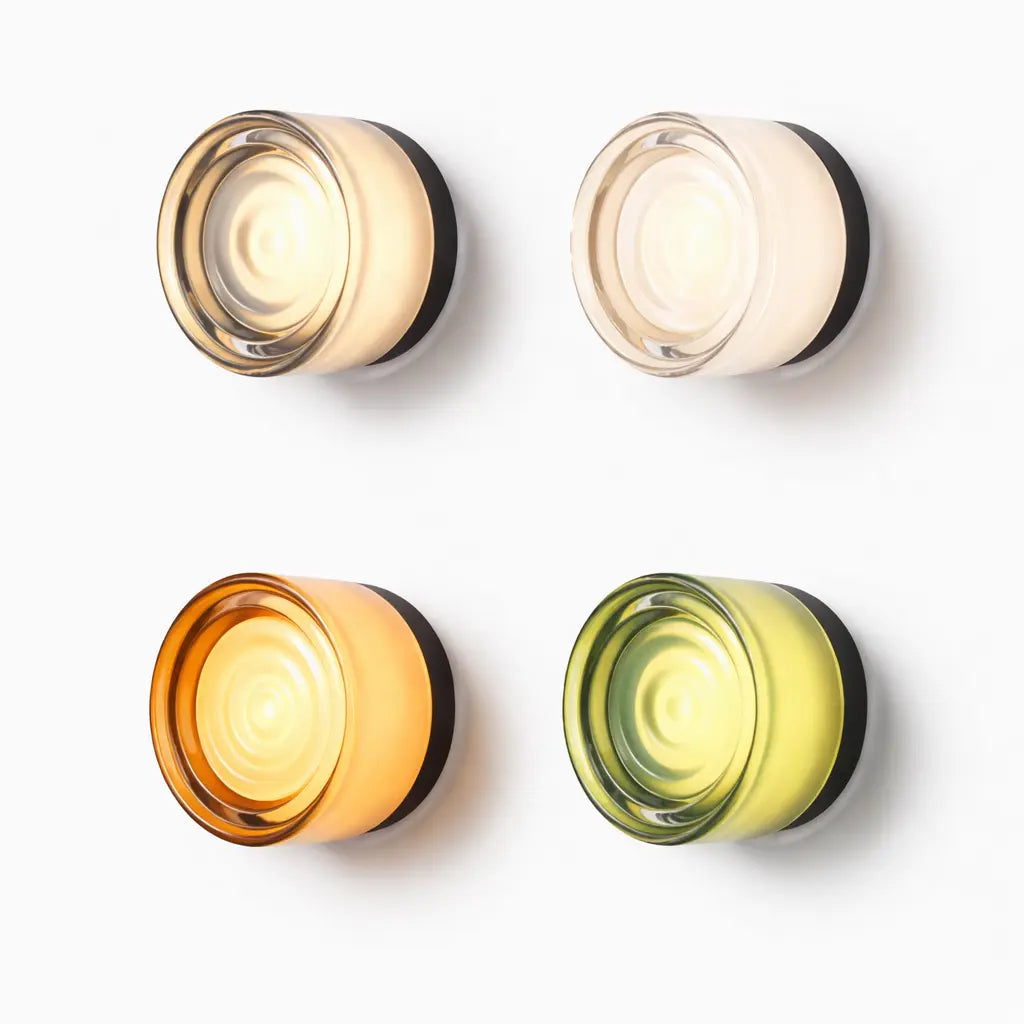 Modern round glass wall light available in four finishes